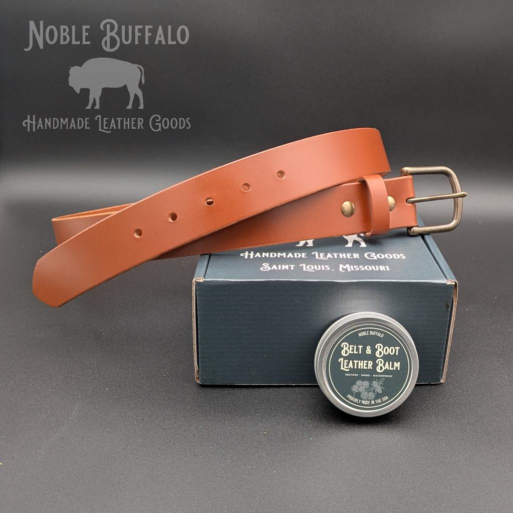 Cognac full grain leather belt handmade in the USA by Noble Buffalo. Warm brown leather belt in cognac and amber brown tones. Unisex classic leather belt.